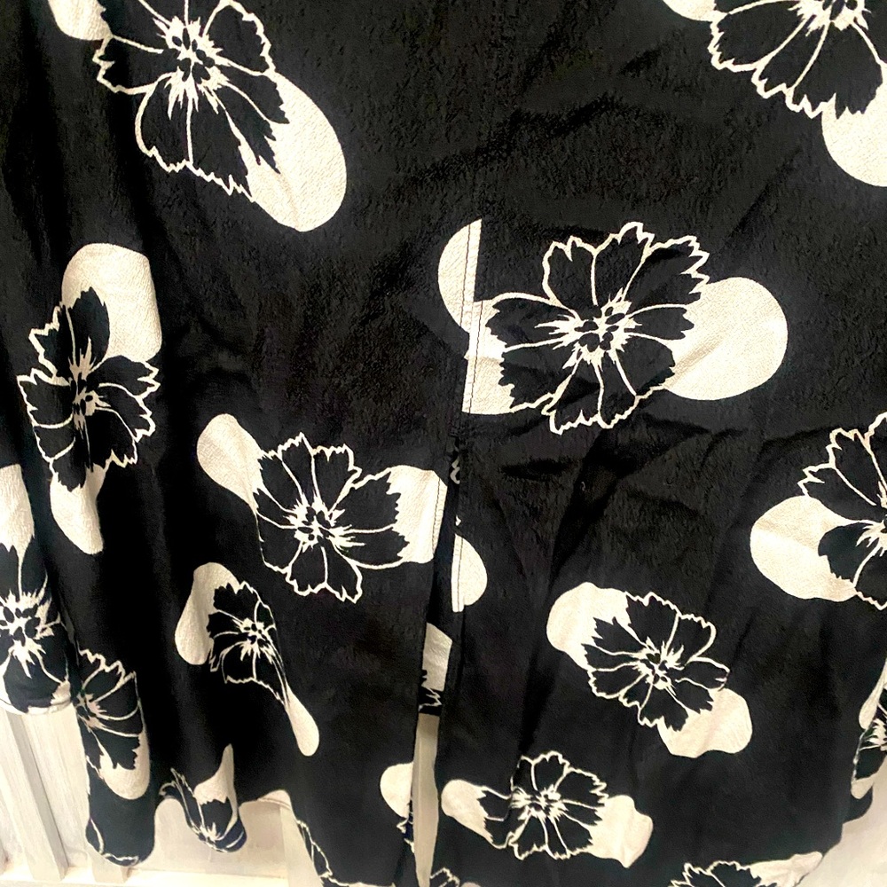 Black and white flowery blouse. Very flattering on